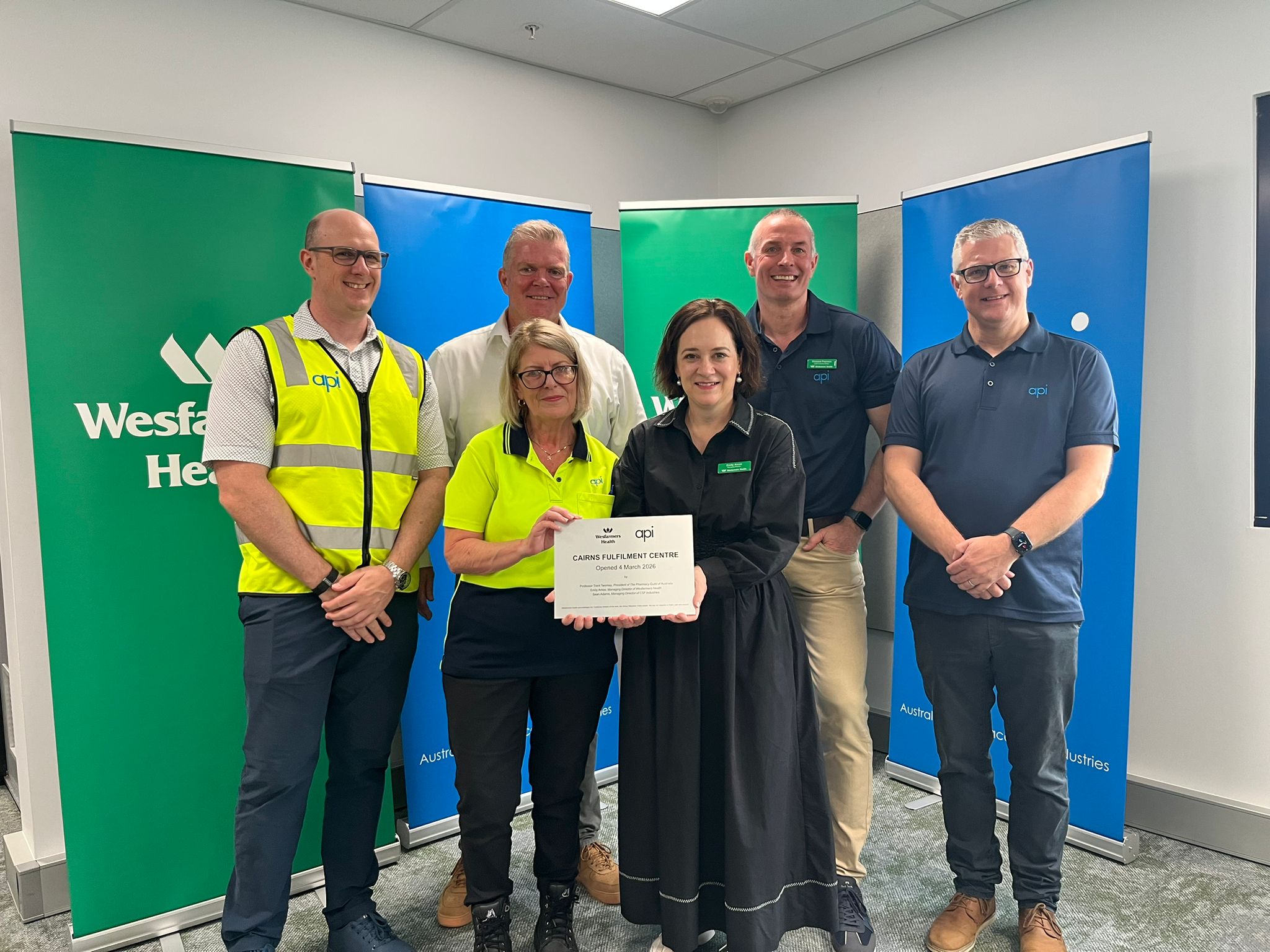 Executive leaders unveiling plaque for new Cairns Fulfilment Centre